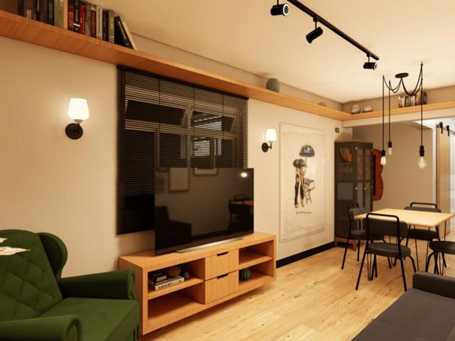 Sala integrada com home theater e sala de jantar em apartamento reformado em São Paulo